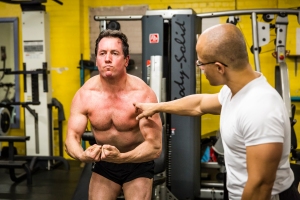 Setting his own standards through -  Mind-muscle connection. 'flexing the muscles' in a "most-muscular' pose.  Chris is an A+ student and the results show for a 47 year old man.  On his way to realizing  a physique and mind-set he imagines himself having. ... adopting my framework to body/mind re-engineering. Vv